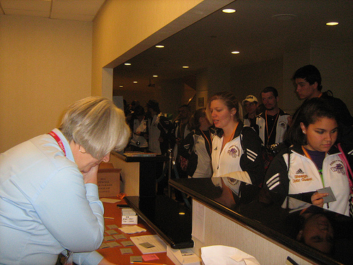 Travel Gallery staff members help check WCU students in to the Hyatt in Anaheim late Tuesday, Dec. 28. 